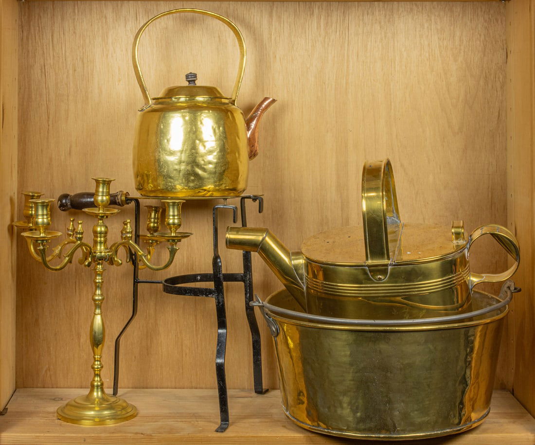 A group of brass: A group of brass, comprising five-light candelabrum; trivet on iron supports; kettle; watering can and brass pot with iron swing handle, greatest 8"h x 18"dia (pot)
