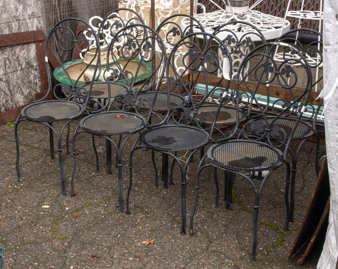 A set of eight black iron patio chairs: A set of eight black iron patio chairs, each seat woven 38.5"h x 16"d of seat