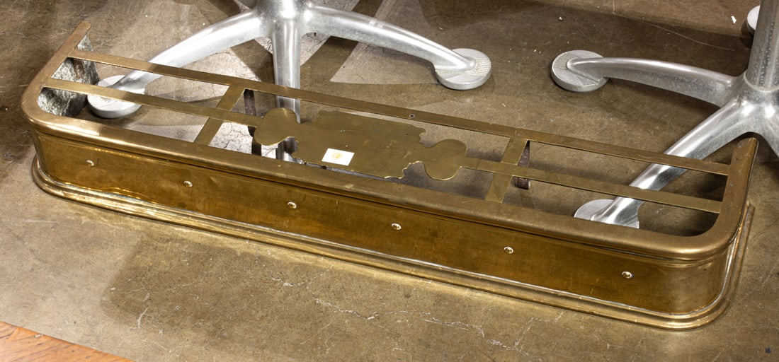 A group of brass: A group of brass, including fire fender; bed warmers; ladle; fire tool stop; Victorian letter rack; wood handled scoop; trivets; Williamsburg Reproductions key box, etc., greatest 48"l (fender)