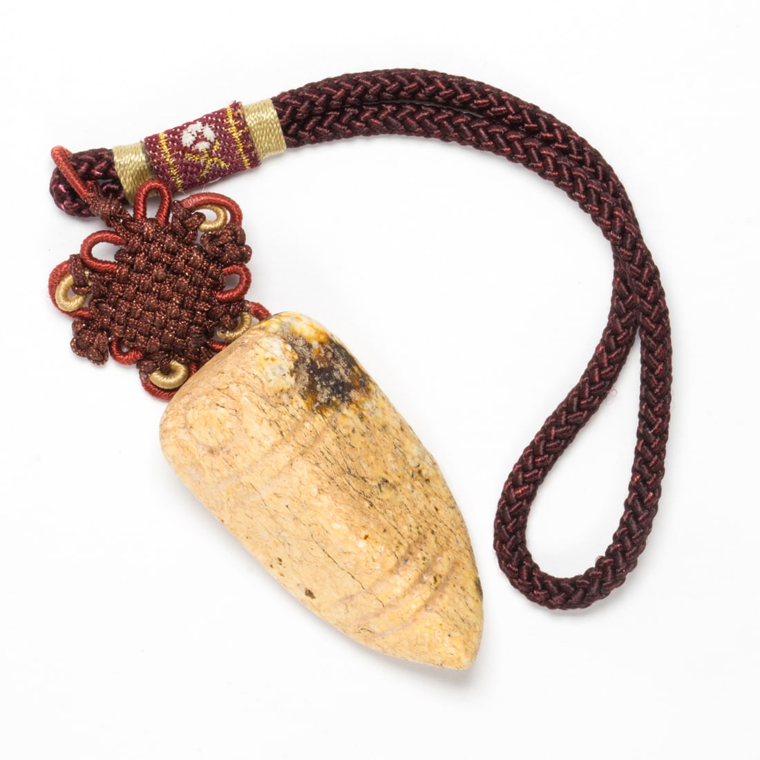 A Chinese archaistic chicken-bone jade cicada pendant: A Chinese archaistic chicken-bone jade cicada pendant. 1.625" across.