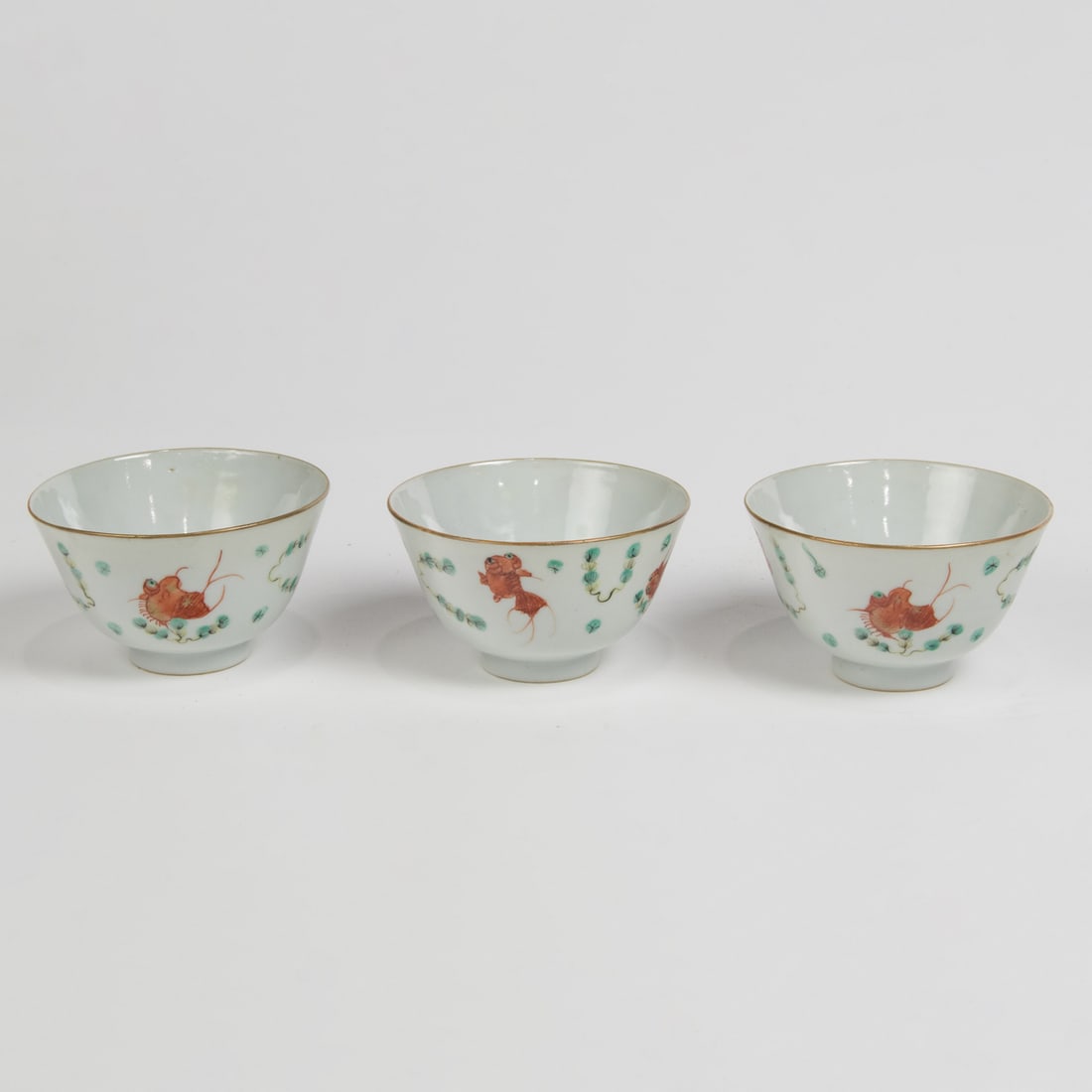 (lot of 3) Chinese famille rose 'goldfish' cups: (lot of 3) Chinese famille rose 'goldfish' cups. Bearing Tongzhi six-character mark, 2.25" high.