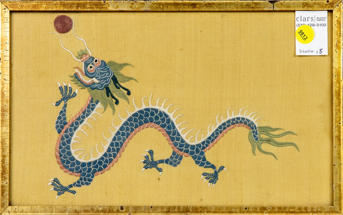 A Chinese embroidered image of a dragon: A Chinese embroidered image of a dragon. Early 20th century, framed and glazed, 7.75"h x 12.5"w.