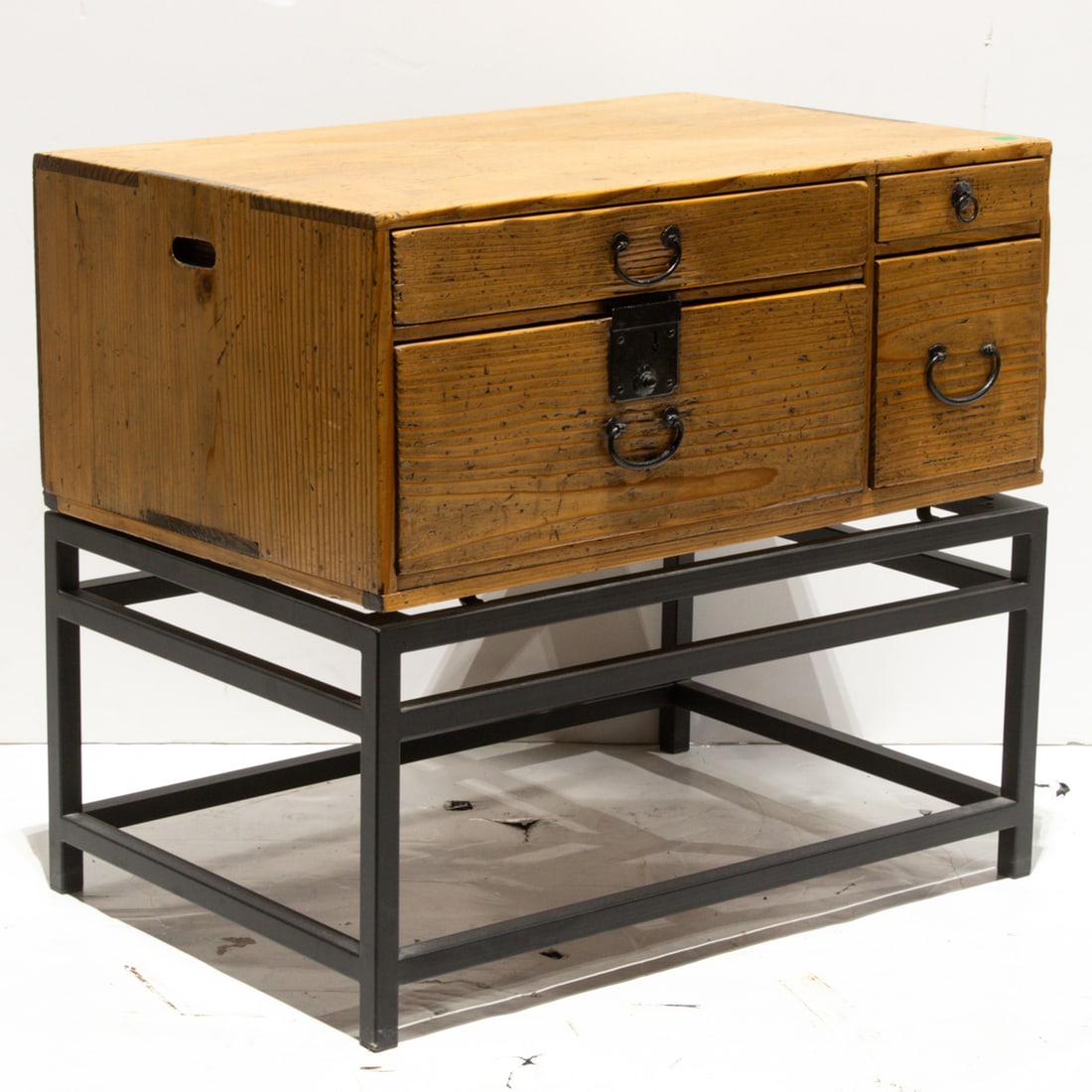 A Japanese tansu and metal stand: A Japanese tansu and metal stand. Early 20th century, 21.5"h x 24"w x 16"d.