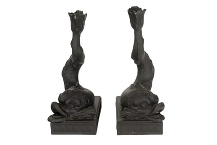 A pair of Wedgwood black basalt dolphin candlesticks