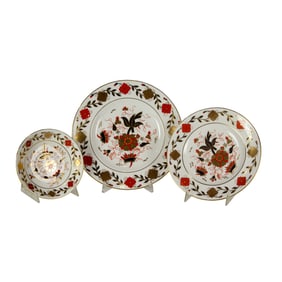 A Royal Crown Derby porcelain partial dinner service in the 'Asian Rose' 8687 pattern,