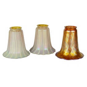 Three Quezal iridescent glass shades