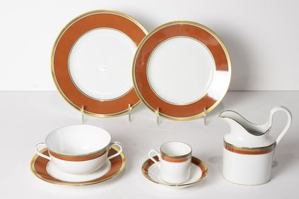 An extensive Ginori porcelain assembled dinner service with rust red and gilt bands in the Contessa