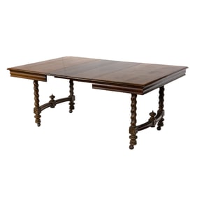 A Renaissance style oak dining dining table
