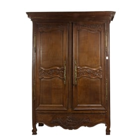 A French Louis XV style oak armoire