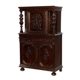 An English carved oak cabinet circa 1920