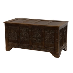 A Gothic Revival carved oak wood trunk