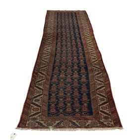 An antique Caucasian runner, 3'5" x 15'1"