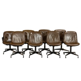 Eight Charles Pollock style leather office chairs