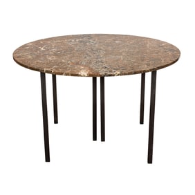 A contemporary marble and metal dining table