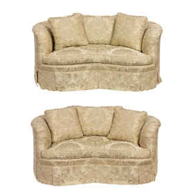 A pair of custom kidney sofas