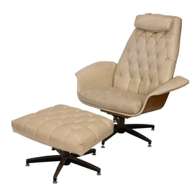 A vintage Charlton chair and ottoman