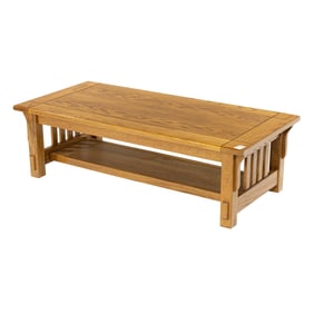 An Arts and Crafts style oak low table, 16"h x 50"w x 24"d  Provenance: Property from the collection