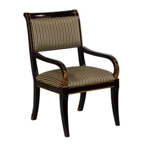 A contemporary partial ebonized armchair in the French taste