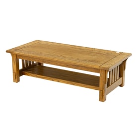 An Arts and Crafts style oak low table, 16"h x 50"w x 24"d  Provenance: Property from the collection