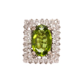 A peridot, diamond and 14k white gold ring