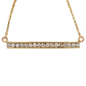 A diamond and 14k gold necklace