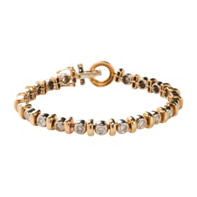 A diamond and 14k bi-color gold bracelet