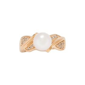 A cultured pearl, diamond and 14k gold ring