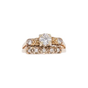 A diamond and 14k gold wedding set