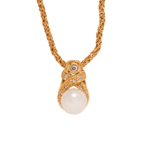A cultured pearl, diamond and 14k gold pendant with 18k gold chain