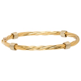 An 18k gold bangle bracelet