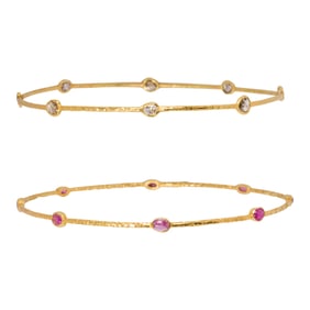 A pair of ruby, diamond and 18k gold bangle bracelets