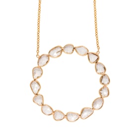 A diamond and 18k gold pendant necklace