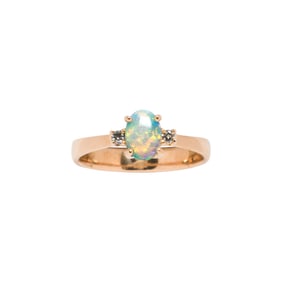 An opal, diamond and 14k gold ring