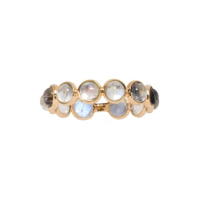 A moonstone and 18k gold eternity ring