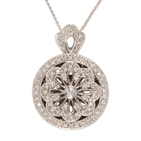 A diamond and 14k white gold locket with chain
