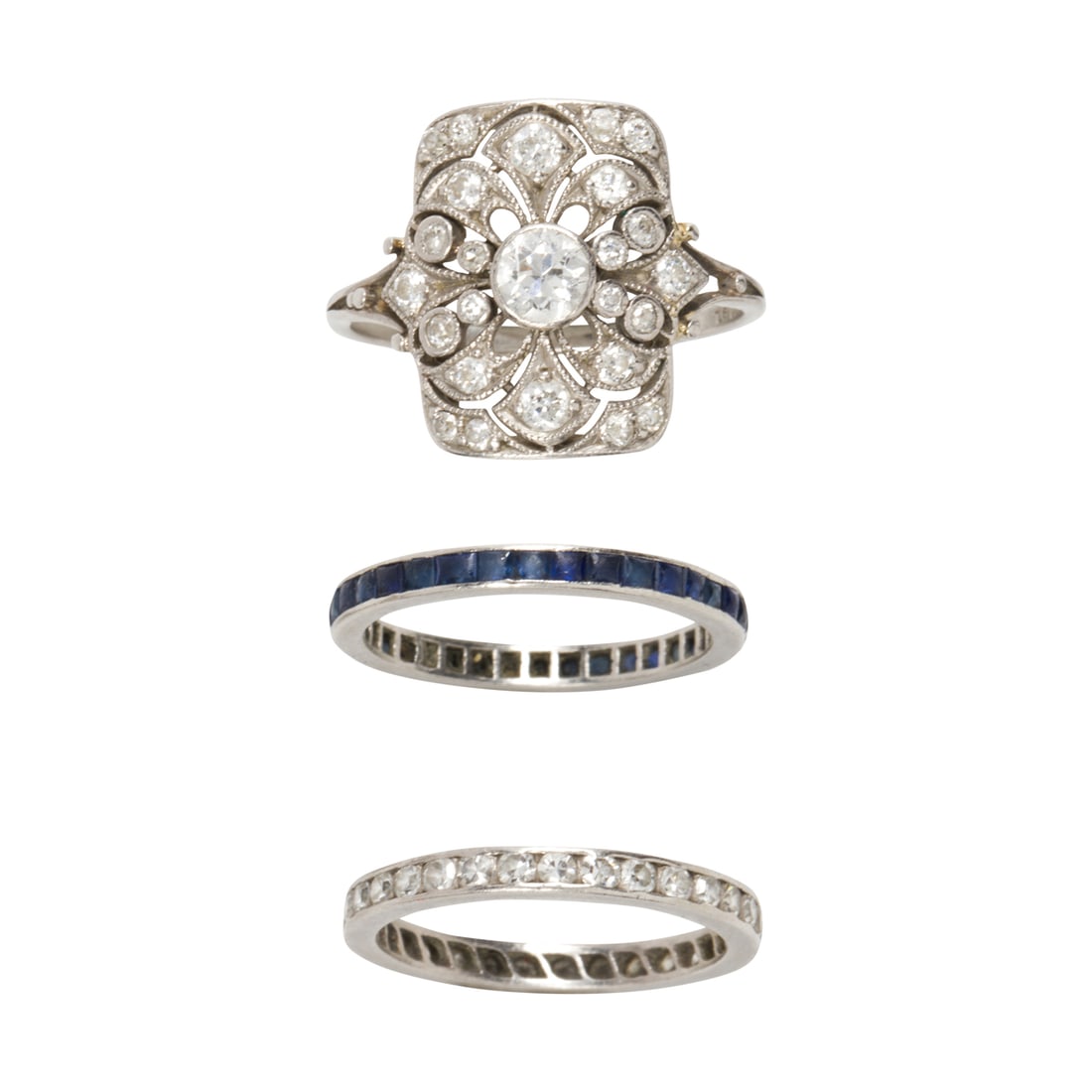Three gem-set and platinum rings (1 of 2)