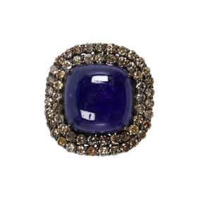 A tanzanite, diamond and blackened silver ring