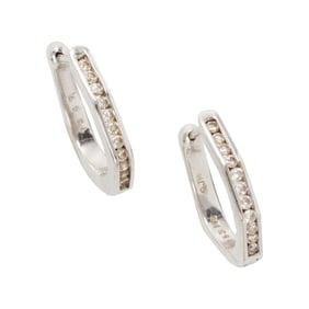 A pair of diamond and 14k white gold earrings