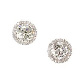 A pair of diamond and 18k white gold stud earrings