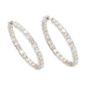 A pair of diamond and 14k hoop earrings