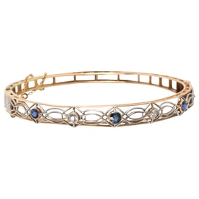 An antique diamond, sapphire and 14k bi-color gold bangle bracelet