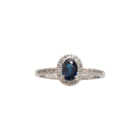A sapphire, diamond and 14k white gold ring