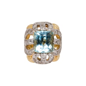 An aquamarine, diamond and 18k bi-color gold ring