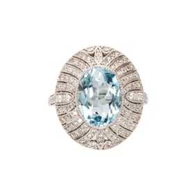 An aquamarine, diamond and 14k white gold ring