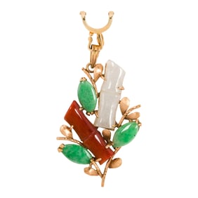 A multi-color jade and 14k gold pendant