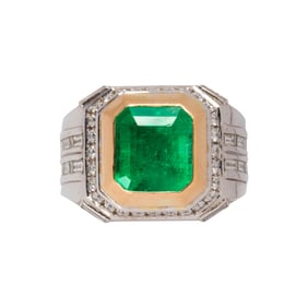 An emerald, diamond and 18k bi-color ring