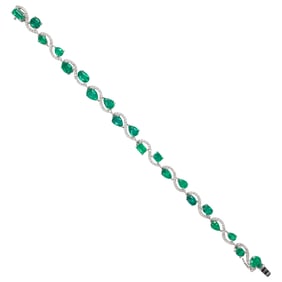 An emerald, diamond and 14k white gold bracelet