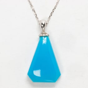 A turquoise and 14k gold pendant necklace