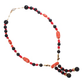 A coral, onyx, diamond and gold necklace