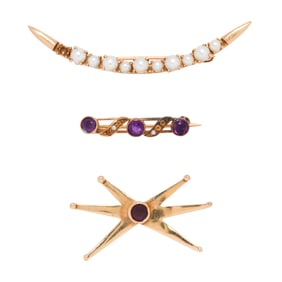 Three gemstone and 14k gold brooches